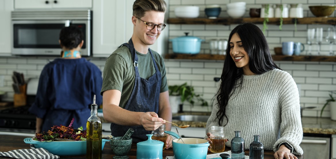 People cooking food with spices