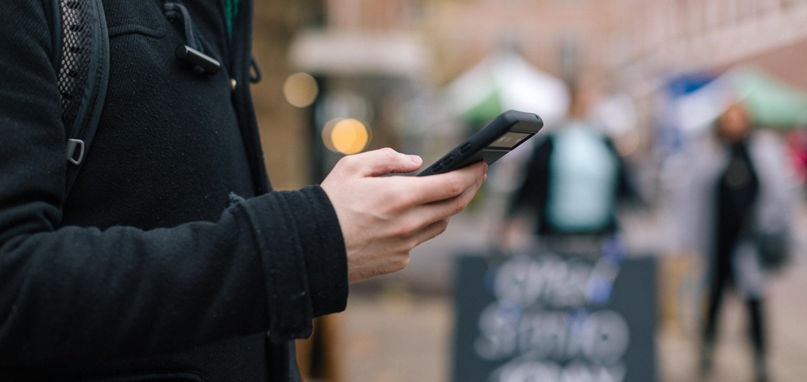 Man on smartphone using an app