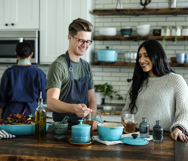 People cooking food with spices