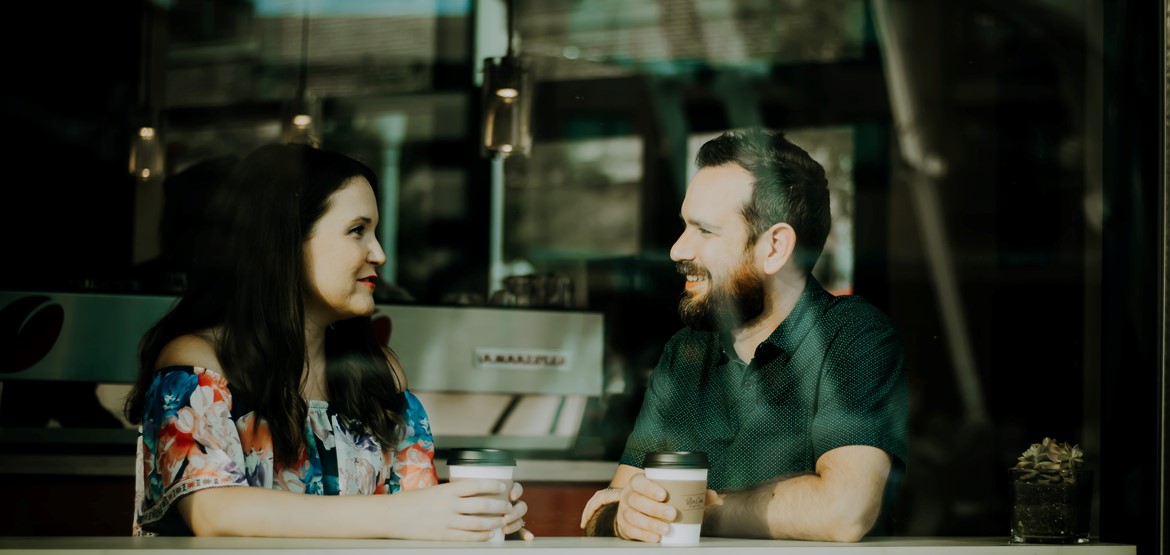 People talking in cafe over coffee