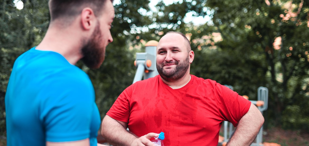 Two men outside exercising and keeping fit