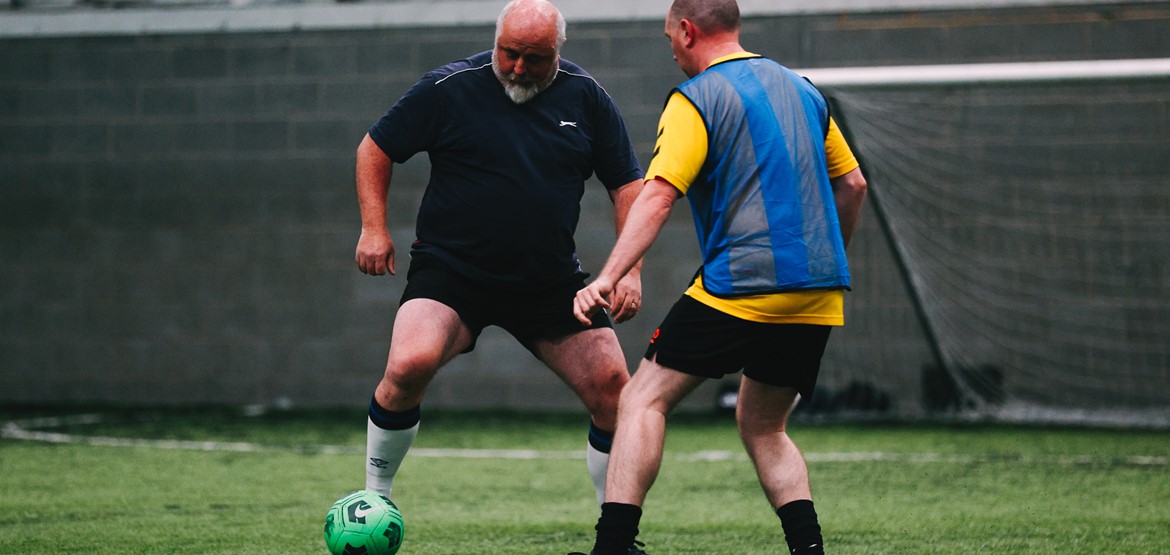 2 men playing walking football