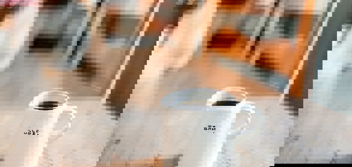 Mug with begin written on it