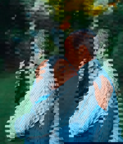 man and woman embracing with their eyes closed