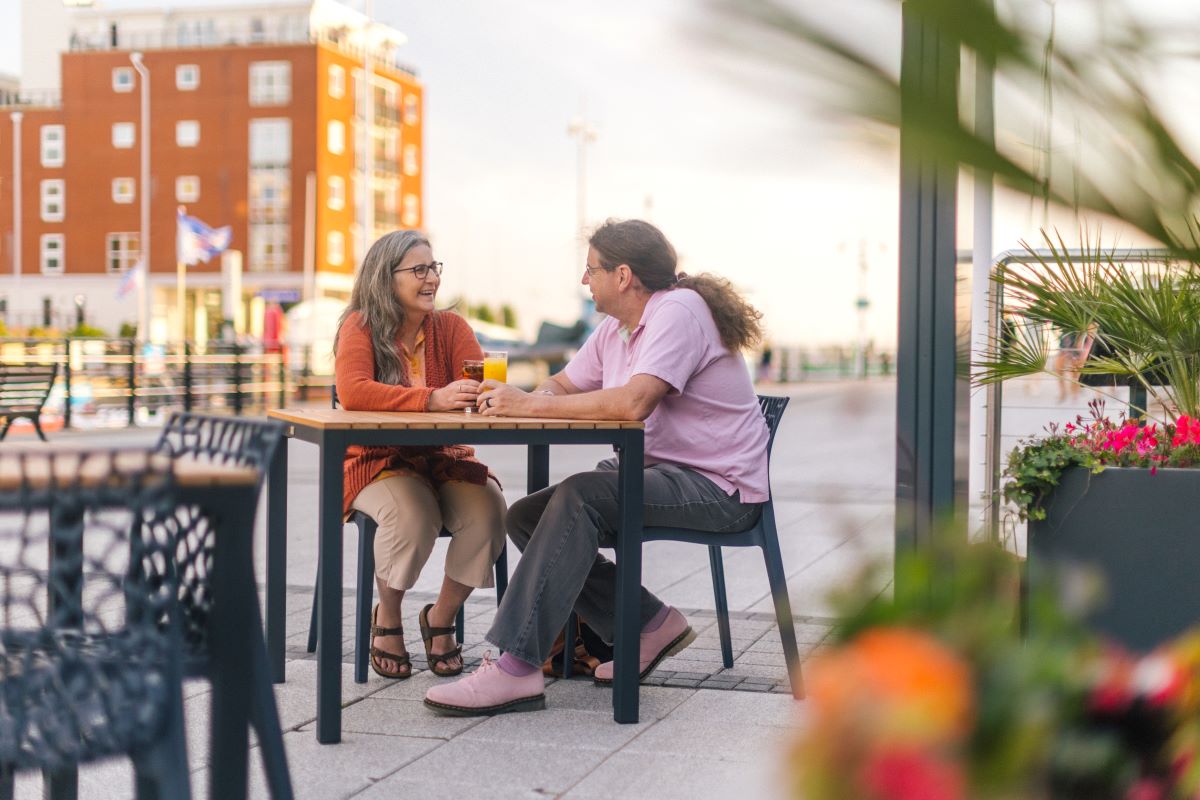Couple Sat Outside Pub With Drinks Pub Settings