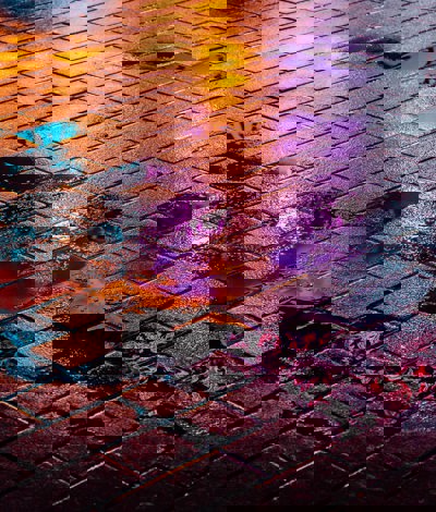 Night time street illuminated with coloured lights