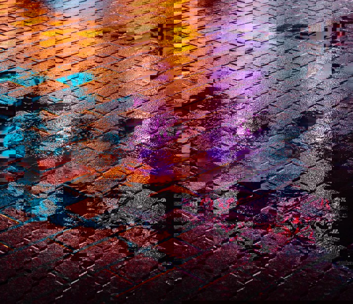 Night time street illuminated with coloured lights