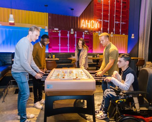 5 people playing table football