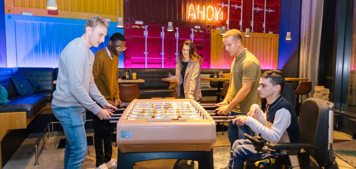 5 people playing table football