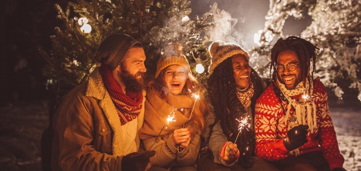 Group of friends holding sparklers