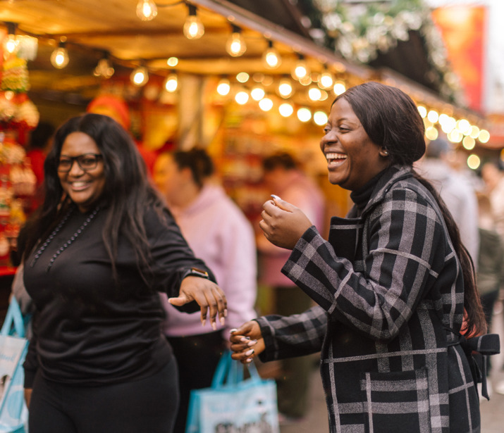 Two friends out at a street fair