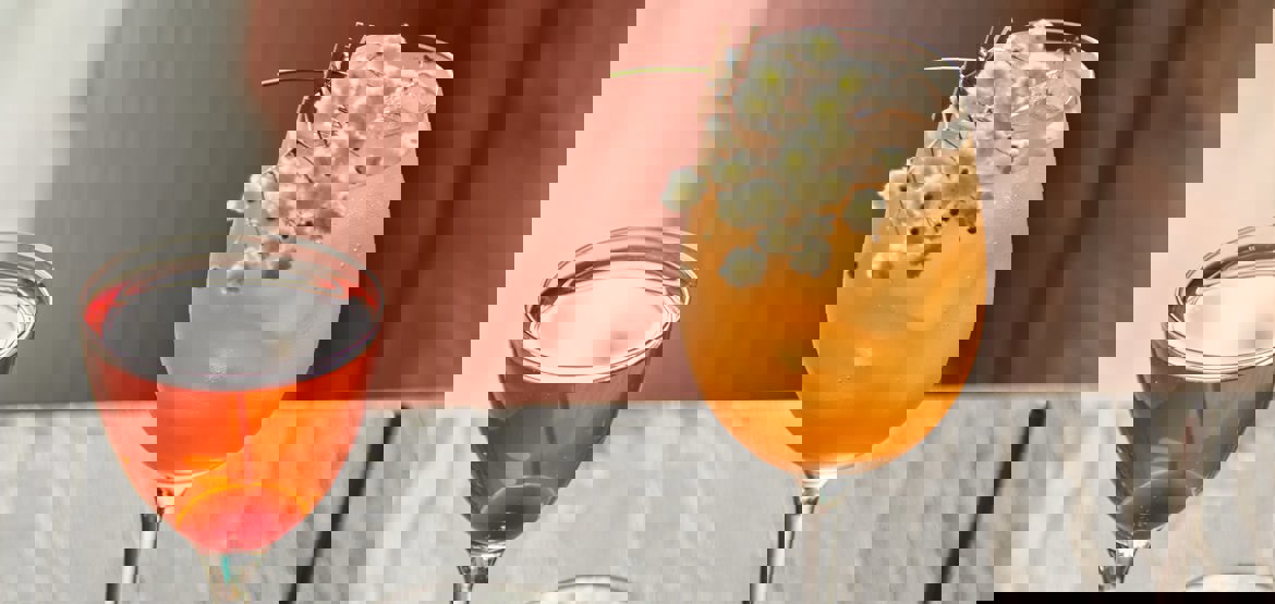 Four glasses on a table containing low alcohol drinks