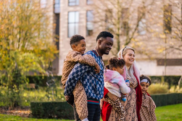 Two Adults Three Children Outside Family