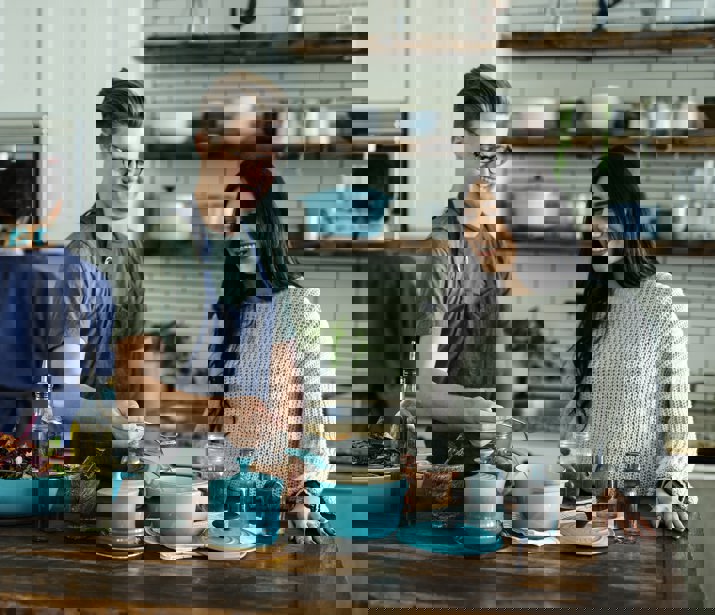 People cooking food with spices