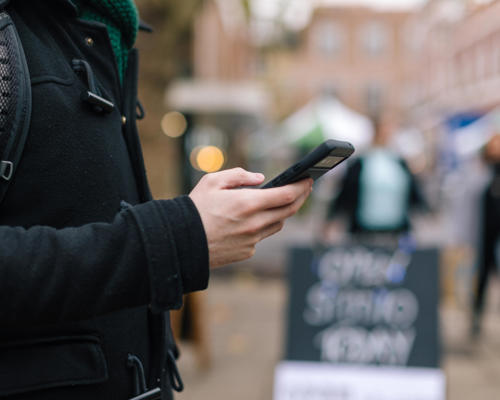 Man on smartphone using an app