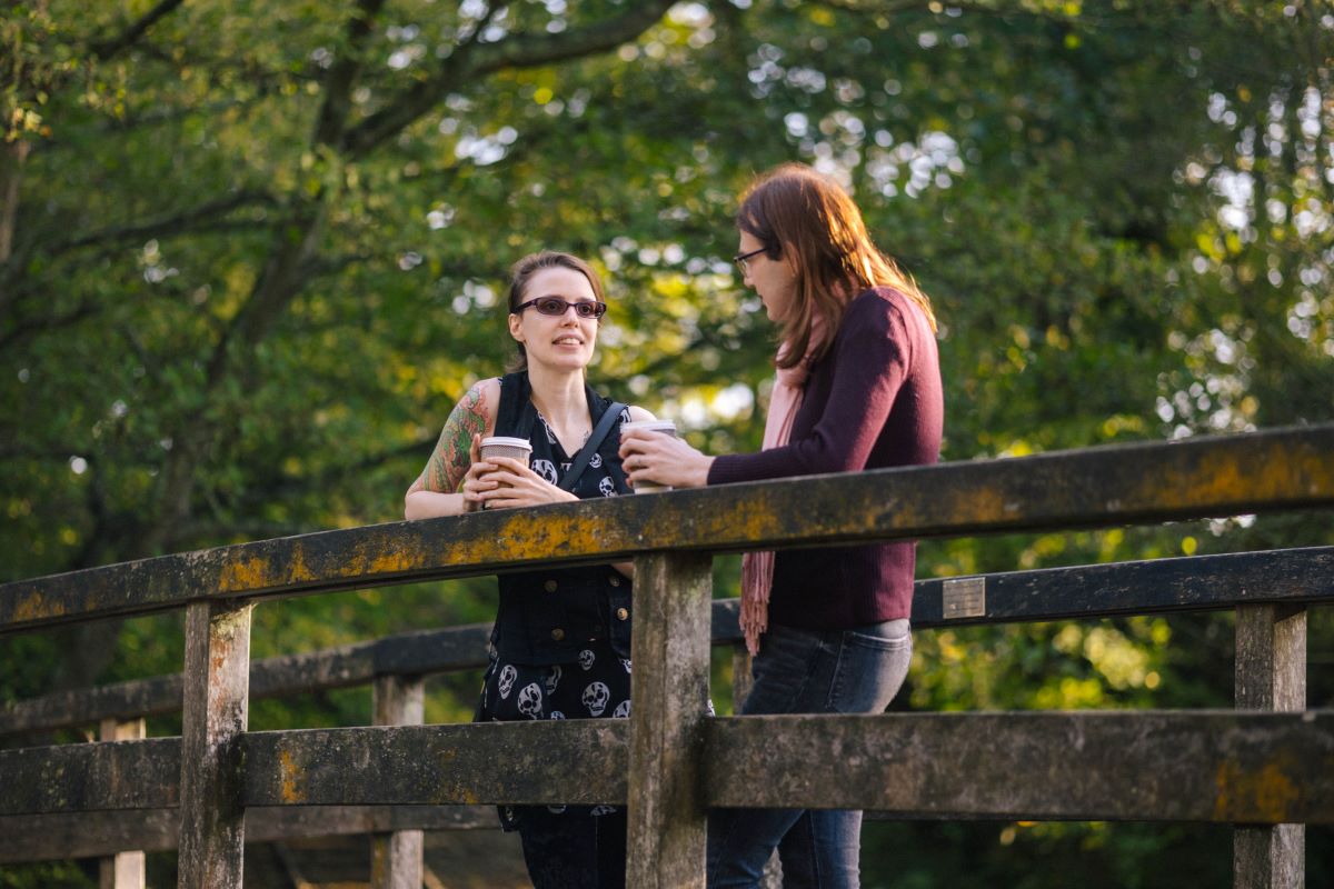 Two People On Bridge Socialising