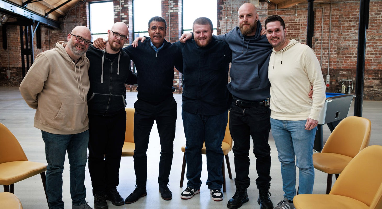 A group of men standing in a line together